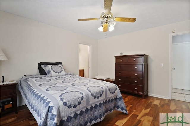 bedroom featuring a ceiling fan and wood finished floors