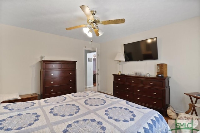 bedroom featuring baseboards and a ceiling fan