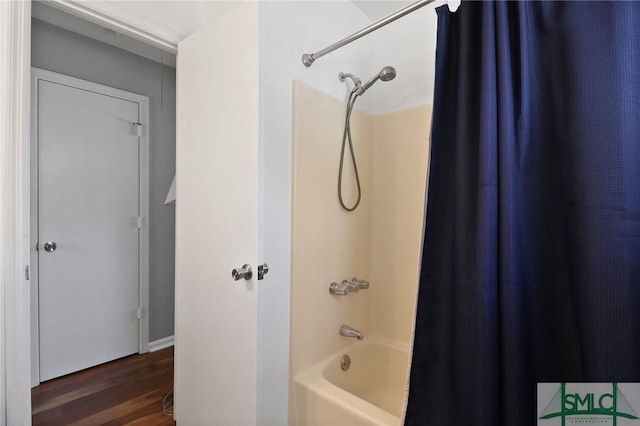 full bath with wood finished floors and shower / bath combination with curtain