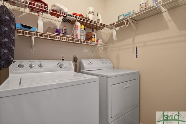 clothes washing area with laundry area and washing machine and dryer