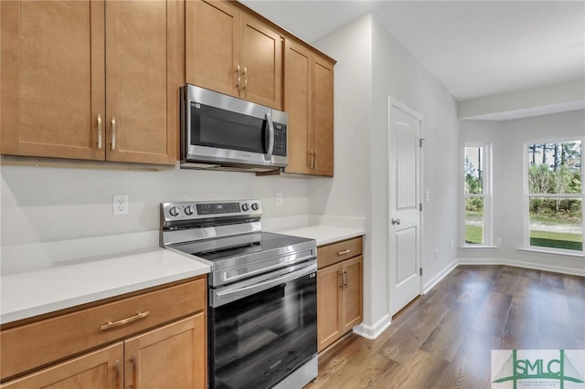 291 Cromer St, Savannah, GA 31407 - kitchen with light countertops, baseboards, appliances with stainless steel finishes, and wood finished floors