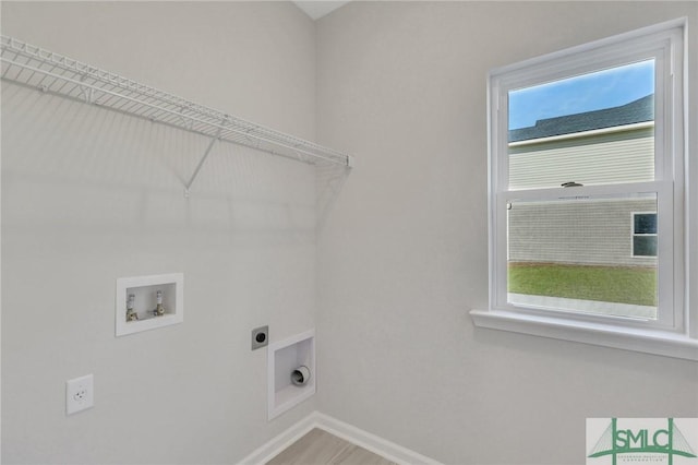 291 Cromer St, Savannah, GA 31407 - washroom featuring laundry area, baseboards, hookup for a washing machine, plenty of natural light, and hookup for an electric dryer