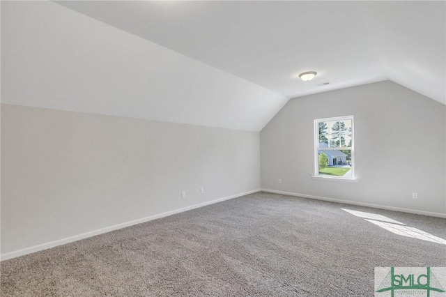 291 Cromer St, Savannah, GA 31407 - additional living space featuring baseboards, carpet, and vaulted ceiling