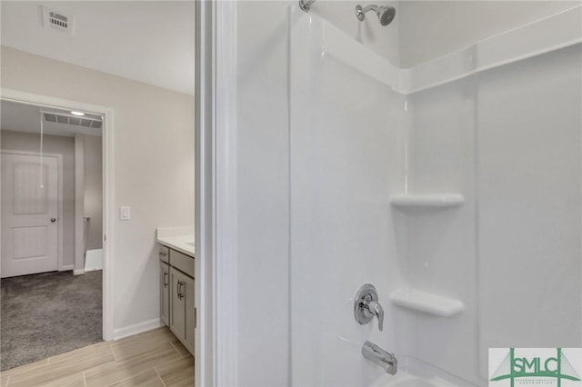 291 Cromer St, Savannah, GA 31407 - full bath with visible vents, wood tiled floor, washtub / shower combination, and vanity