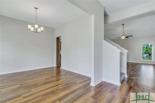 291 Cromer St, Savannah, GA 31407 - unfurnished room featuring visible vents, wood finished floors, baseboards, stairway, and ceiling fan with notable chandelier