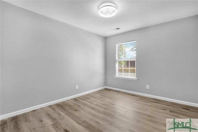 108 Church St, Bloomingdale, GA 31302 - spare room with wood finished floors and baseboards
