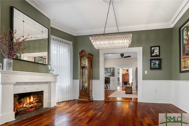 interior space with a wealth of natural light, wood finished floors, and a fireplace
