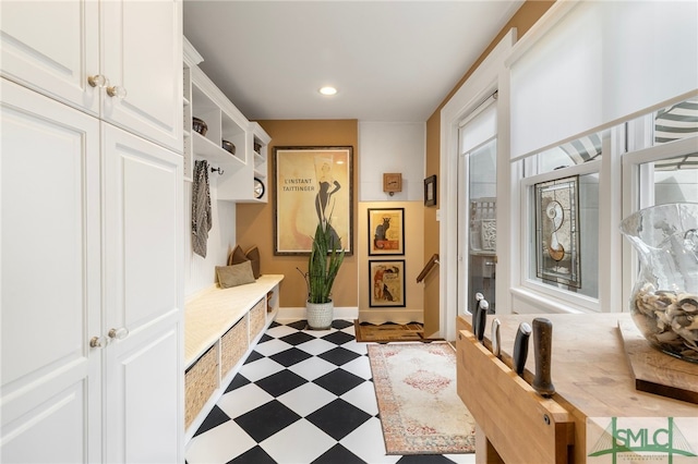 mudroom with light floors, baseboards, and recessed lighting