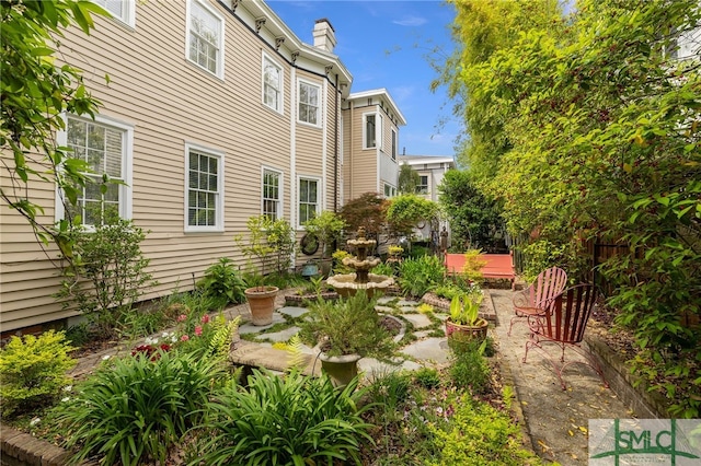 view of yard featuring a patio area and fence