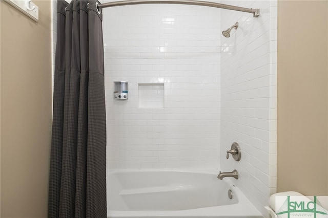 bathroom featuring shower / bath combination with curtain