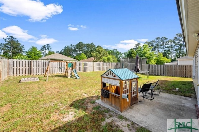 view of yard featuring a playground, a fenced backyard, a patio, and a trampoline