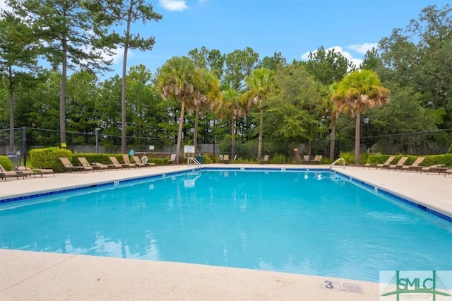 pool featuring fence