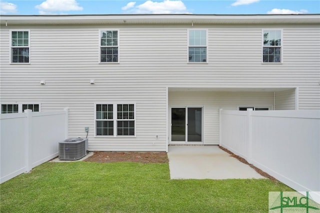 446 Governor Treutlen Cir Unit 22, Pooler, GA 31322 - back of property with central AC, fence, a yard, and a patio