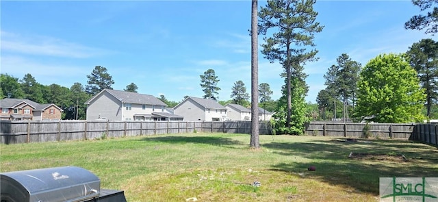 14 Canterbury Rd NE, Ludowici, GA 31316 - view of yard with a fenced backyard and a residential view