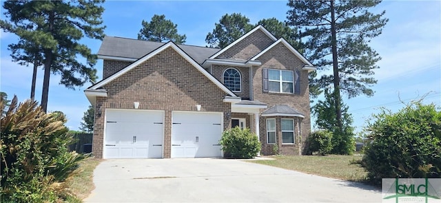 14 Canterbury Rd NE, Ludowici, GA 31316 - traditional-style house featuring brick siding, a garage, and concrete driveway