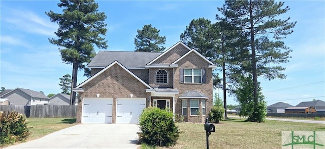 14 Canterbury Rd NE, Ludowici, GA 31316 - view of front of home with driveway, a garage, brick siding, fence, and a front lawn