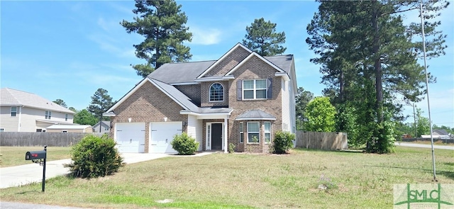 14 Canterbury Rd NE, Ludowici, GA 31316 - traditional-style house featuring brick siding, fence, driveway, and a front yard