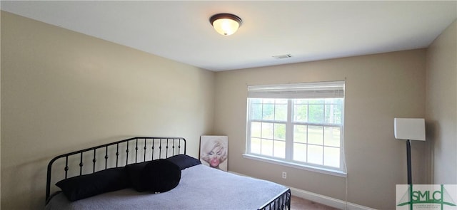 14 Canterbury Rd NE, Ludowici, GA 31316 - carpeted bedroom with baseboards and visible vents