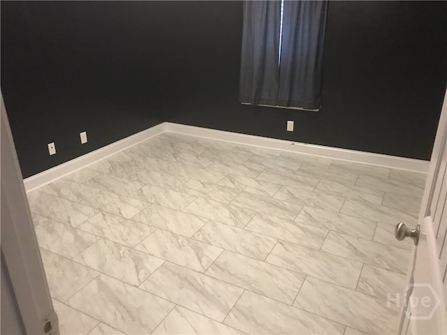 14 Canterbury Rd NE, Ludowici, GA 31316 - unfurnished room with baseboards and marble look tile flooring