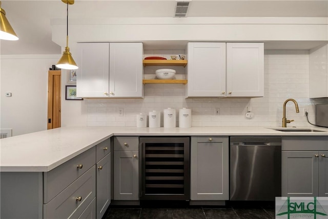 kitchen featuring beverage cooler, backsplash, dishwasher, and gray cabinetry