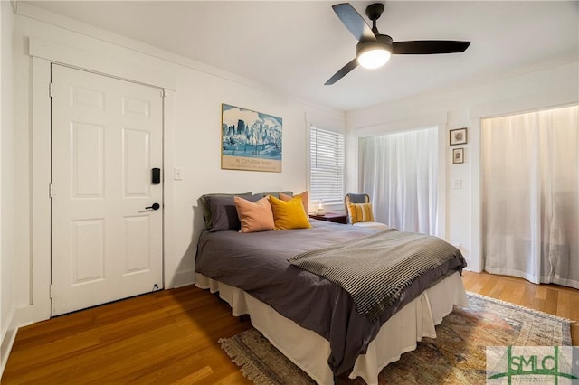 bedroom featuring ceiling fan and wood finished floors