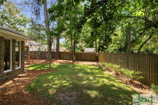 view of yard featuring a fenced backyard
