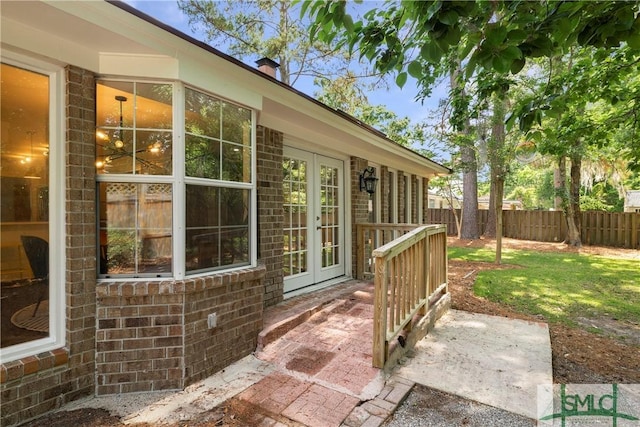 view of patio featuring fence and french doors