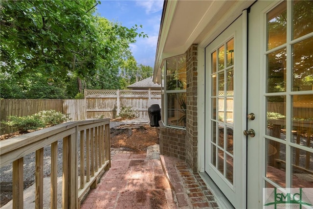 view of patio with a fenced backyard and french doors