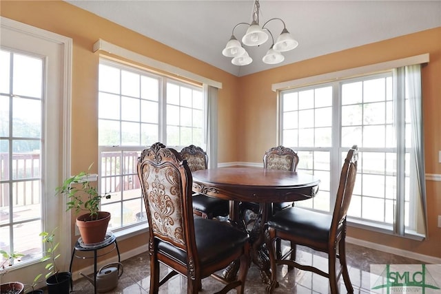 dining room with baseboards, an inviting chandelier, and tile patterned floors