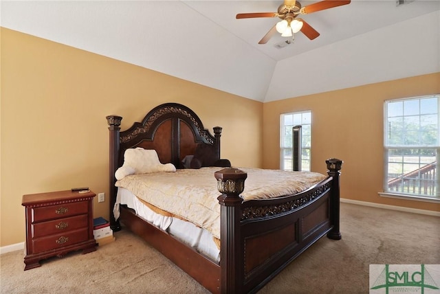 carpeted bedroom with baseboards, ceiling fan, visible vents, and vaulted ceiling