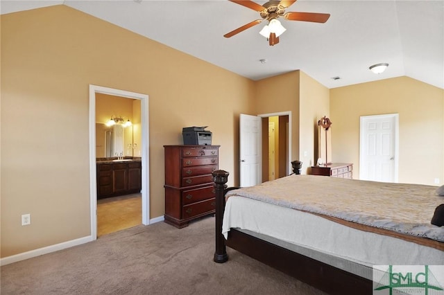 bedroom with lofted ceiling, baseboards, light colored carpet, a ceiling fan, and ensuite bath