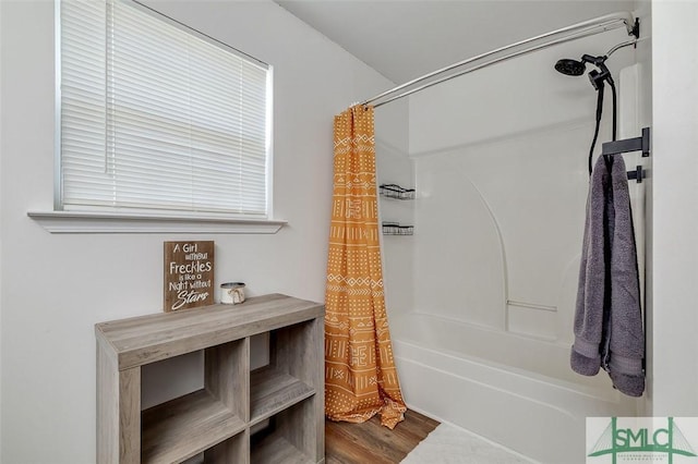 full bathroom with wood finished floors and shower / bath combination with curtain