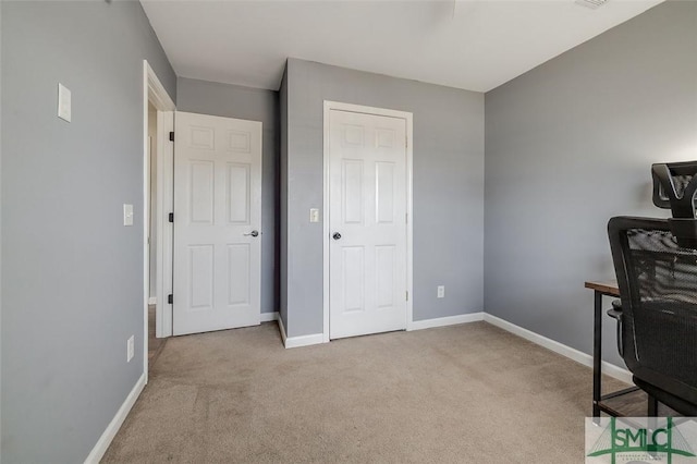 home office with baseboards, carpet, and visible vents