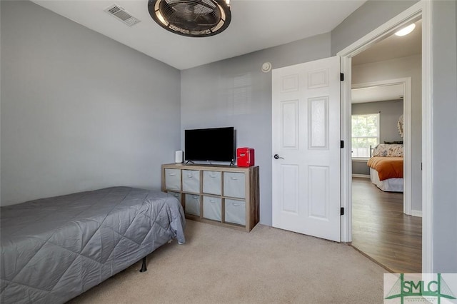bedroom featuring carpet and visible vents