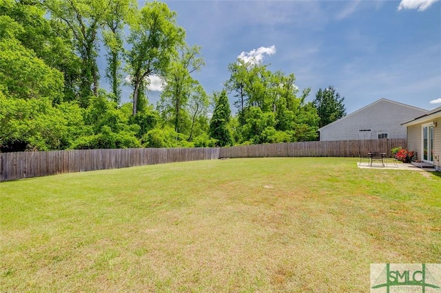 view of yard featuring a fenced backyard and a patio area