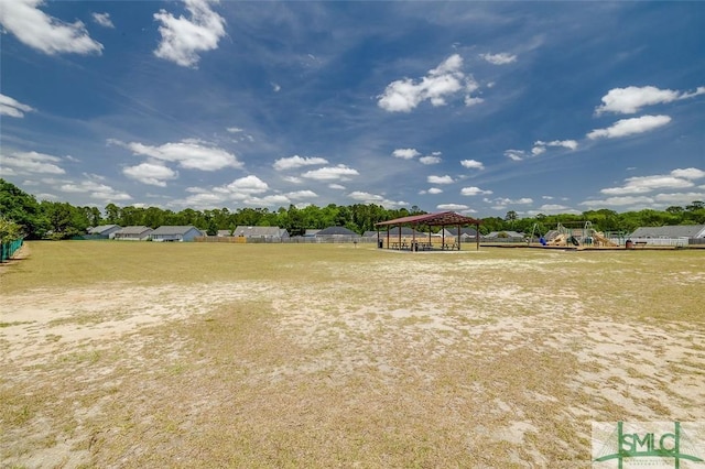 view of yard featuring a gazebo and playground community