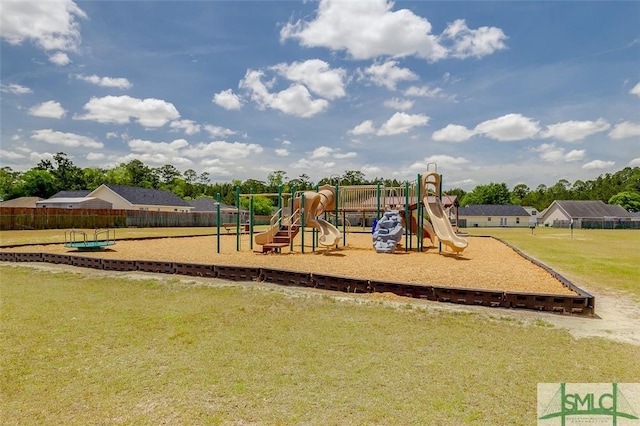 community jungle gym with a yard and fence