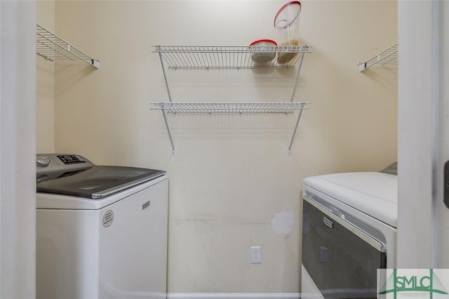 laundry area with independent washer and dryer and laundry area
