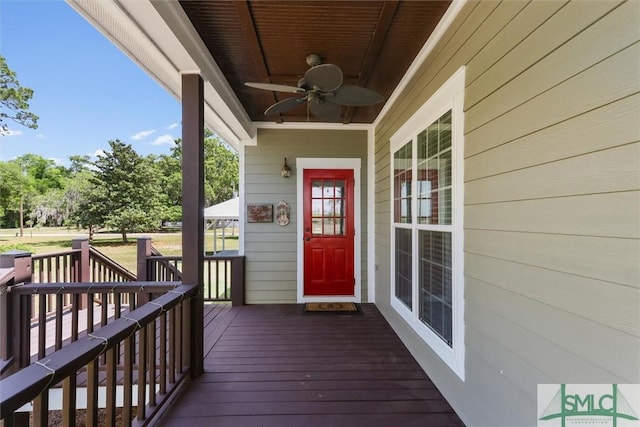 deck with a porch and ceiling fan