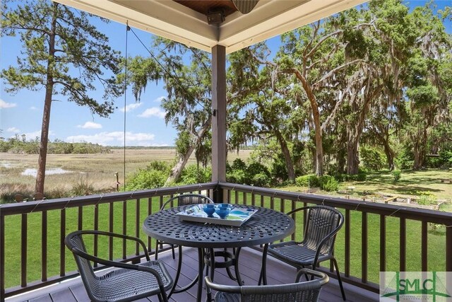 1261 Otter Slide Loop NE, Townsend, GA 31331 - wooden deck featuring a yard