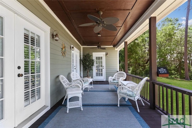 exterior space featuring covered porch, french doors, and ceiling fan