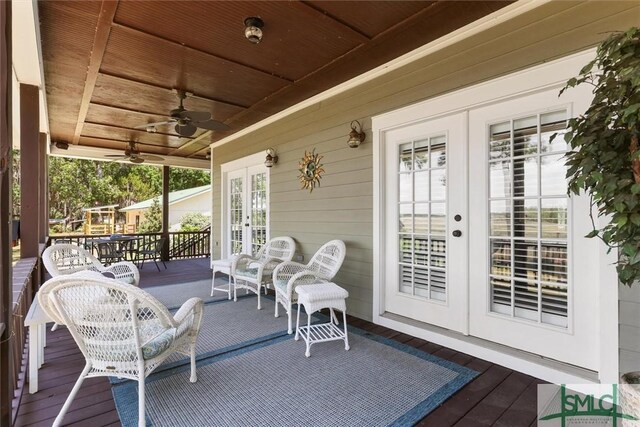 1261 Otter Slide Loop NE, Townsend, GA 31331 - view of patio / terrace featuring french doors, a ceiling fan, and a wooden deck