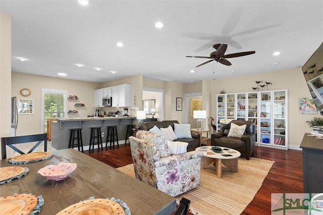 living room with ceiling fan, dark wood-style floors, and recessed lighting