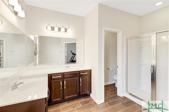 98 Westbourne Way, Savannah, GA 31407 - bathroom featuring double vanity, wood tiled floor, toilet, and a shower stall