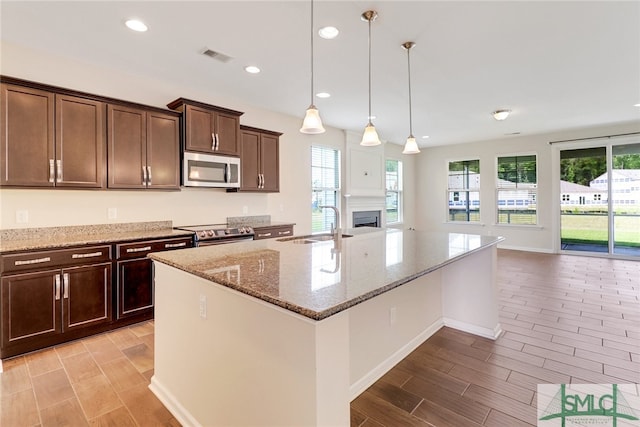 98 Westbourne Way, Savannah, GA 31407 - kitchen featuring a sink, a wealth of natural light, wood tiled floor, and stainless steel appliances
