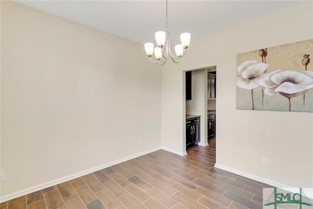 98 Westbourne Way, Savannah, GA 31407 - empty room with an inviting chandelier, wood tiled floor, and baseboards