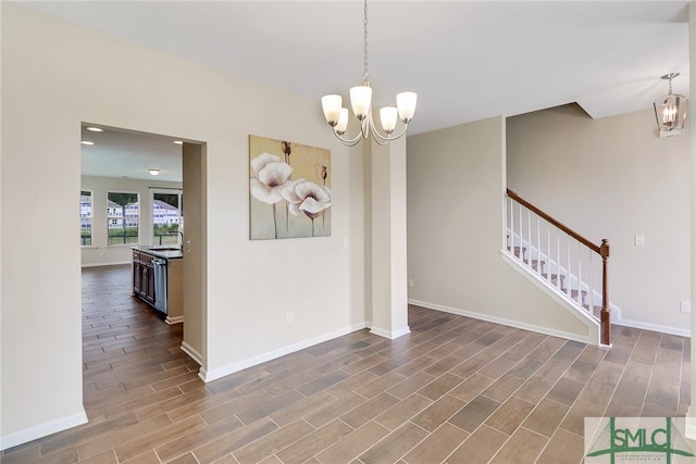 98 Westbourne Way, Savannah, GA 31407 - unfurnished dining area featuring stairs, baseboards, a chandelier, and wood finished floors