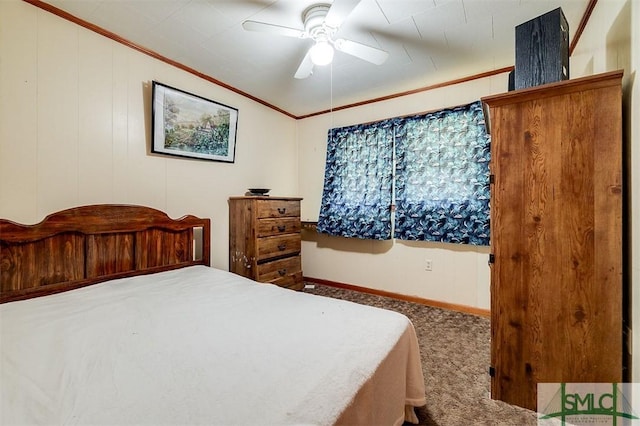 bedroom with carpet floors, ornamental molding, baseboards, and a ceiling fan