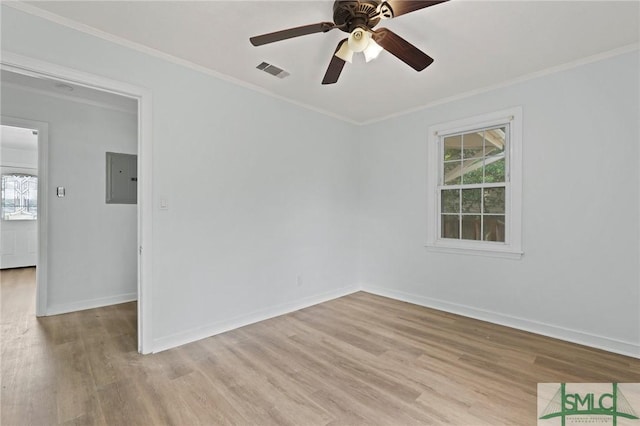 unfurnished room featuring ceiling fan, electric panel, light wood-style flooring, and visible vents
