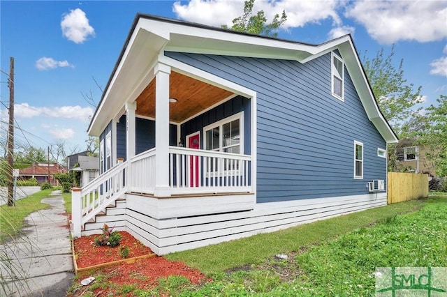 view of property exterior with a porch